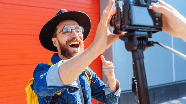 man smiling with thumb up, in front of camera