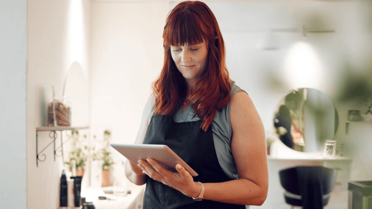 woman with red hair, on ipad